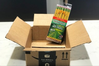 A pack of Ticonderoga pencils in an open Amazon box