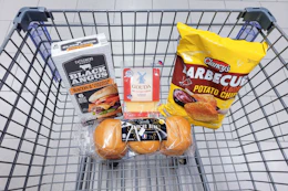 burgers, buns, sliced cheese, and chips in a cart