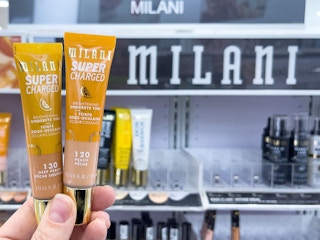 someone holding a milani super charged tint