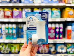 hand holding a Glade plugin warmer