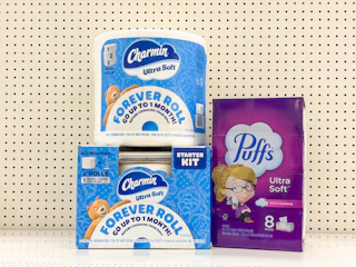 2 charmin and 1 puffs sitting on a target shelf