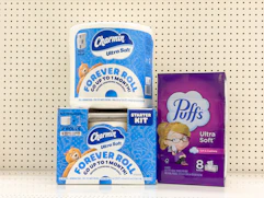2 charmin and 1 puffs sitting on a target shelf