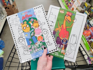 hand holding 2 color your own puzzles