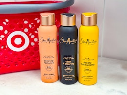 3 SheaMoisture Body Washes in front of Target shopping basket