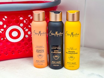3 SheaMoisture Body Washes in front of Target shopping basket