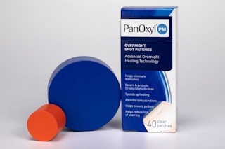 a box of 40 panoxyl pimple patches next to blue and orange cylinders