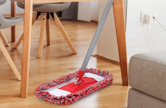 a red and grey dust mop on hardwood floors
