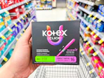 hand holding kotex tampons in walgreens