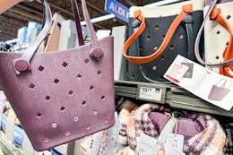 hand holding up a haul it all tote bag at aldi