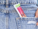 a tampon in a back pocket of jeans
