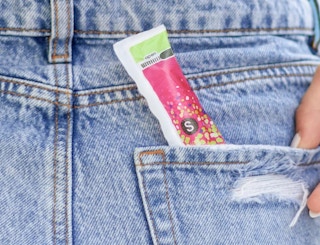 a tampon in a back pocket of jeans