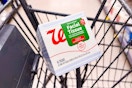person placing a box of tissues in a cart