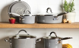 grey pots and pans on a shelf