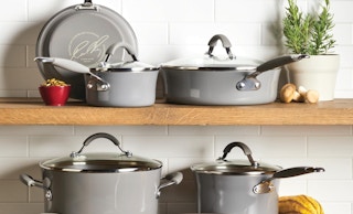 grey pots and pans on a shelf