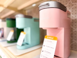 pink and blue keurig mini on shelf
