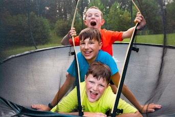 kids playing on a trampoline