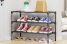 a black shoe rack near a door