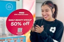 a sales sign in ulta with a woman behind shopping and testing products
