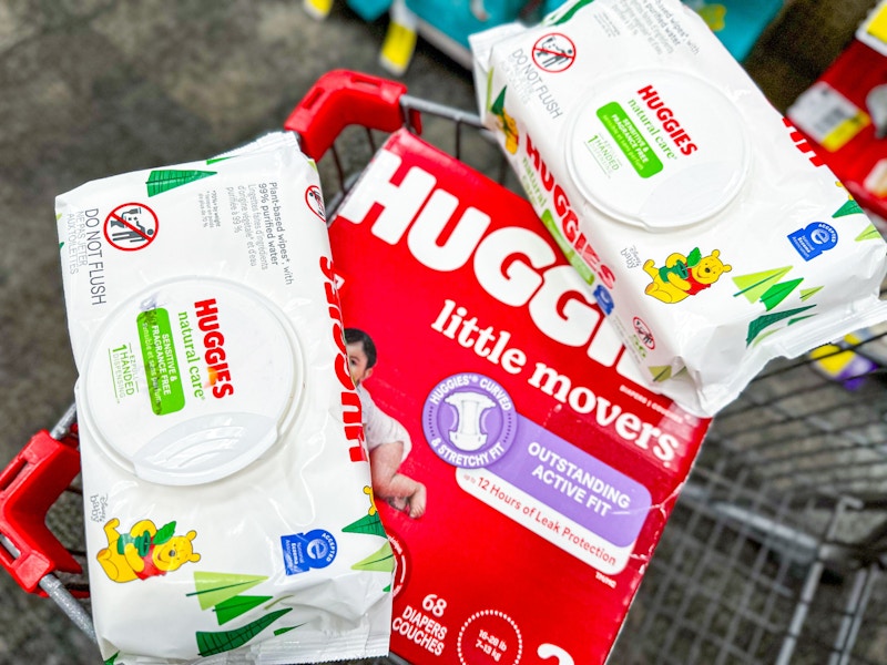 box of huggies diapers and 2 packs of huggies wipes in a cart