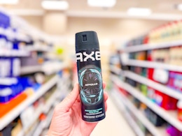 hand holding an axe spray in a target aisle