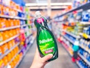 hand holding Palmolive dish soap